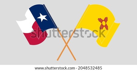 Crossed and waving flags of the State of Texas and the State of New Mexico
