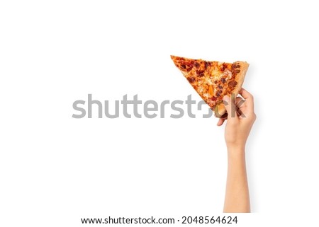Slice of pepperoni pizza in hand isolated on white. Top view on paperoni pizza. Concept for italian food, street food, fast food, quick bite. Banner with copy space.