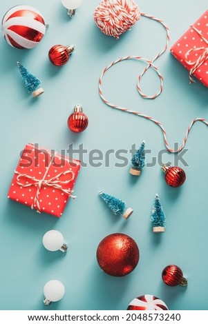 Christmas classic decorations and gift boxes on blue background. Vintage style. Flat lay, top view. 