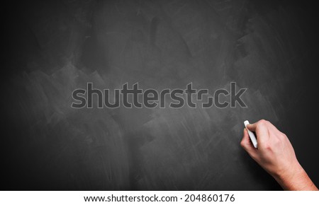 hand with chalk, starting to write Royalty-Free Stock Photo #204860176