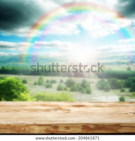 yellow wooden desk and rainbow space 