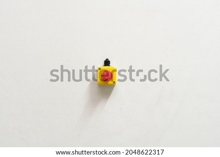 Stop Red Button and the Hand of Worker About to Press it. emergency stop button. Big Red emergency button or stop button for manual pressing. Royalty-Free Stock Photo #2048622317