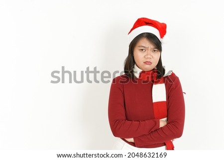 Angry Gesture Face Expression of Beautiful Asian Woman Wearing Red Turtleneck and Santa Hat Isolated On White Background