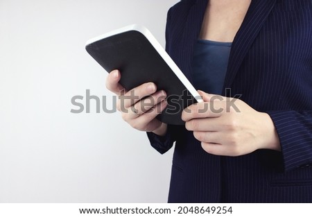 Concept of technology, connection, communication, social. Businesswoman hand using digital tablet. Hands Holding A Tablet Touch Computer. Digital marketing