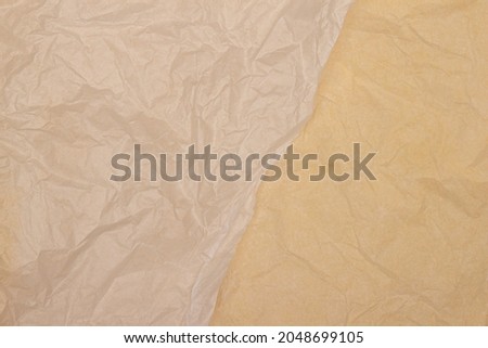 Two yellow color tone old wrinkled creased paper background texture