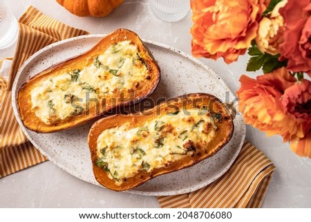 Baked Butternut Squash Pumpkin Stuffed with Spinach and Ricotta Cheese Royalty-Free Stock Photo #2048706080