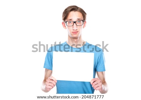 portrait of young cheerful caucasian man which holding sign with funny expression
