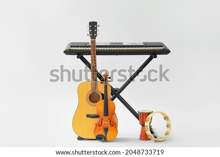 Different musical instruments on white background