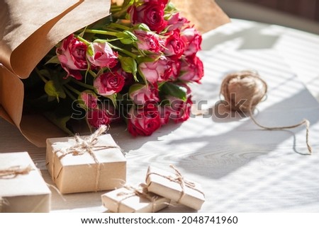 Flowers, present boxes from eco friendly materials. Natural concept for holidays.