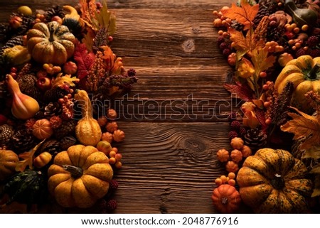 Autumn background. Thanksgiving celebration. Rustic wooden table. Place for text.
