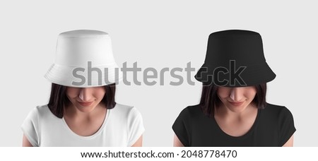 Mockup of a white, black panama on a young dark-haired girl, isolated on background. A set of stylish headwear for the summer. Accessory for women, blank hat for design, product advertising Royalty-Free Stock Photo #2048778470