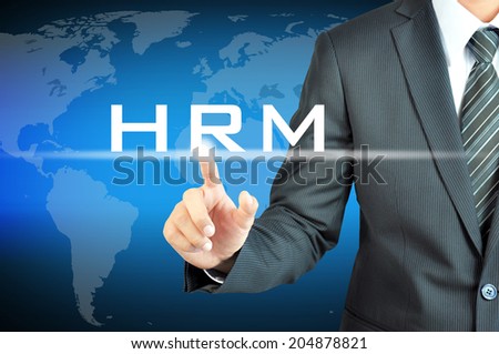 Businessman hand touching HRM (or Human Resources Management) sign on virtual screen