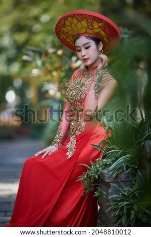 Ho Chi Minh city, Viet Nam: Vietnamese brides wear ao dai to take wedding photos at the temple 