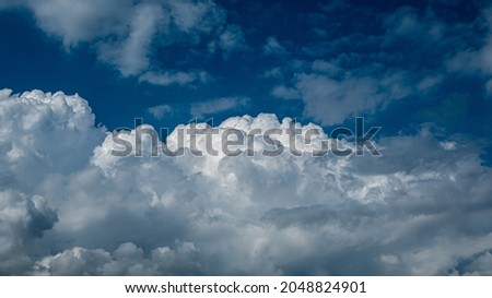 a cloudy landscape with cumulus clouds. to the desktop. awesome beauty