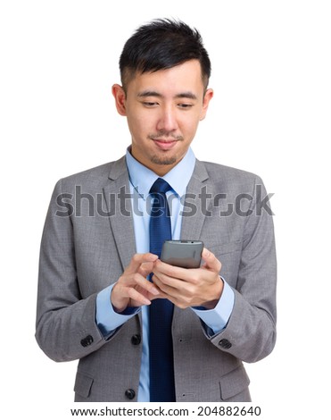 Businessman look at cellphone