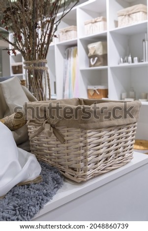 Organization of home space, order, cleanliness and comfort. Household goods storage equipment. Wicker baskets made of trendy natural eco-friendly materials. Interior decor element.