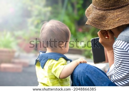 Happy grandmother and son, record video call on smartphone, take pictures on phone, joys of fun and relaxation application is an online social video chat call and copy space.