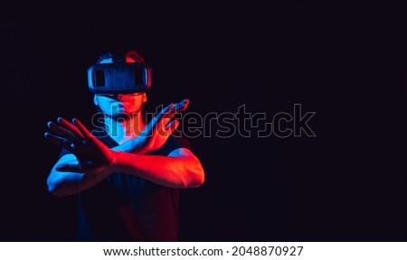 young man using VR virtual reality glasses headset. with space for text