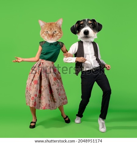 Retro dances. Young man and woman headed with dog's heads dancing isolated over green background. Modern design, contemporary art collage. Inspiration, idea, magazine style. Surrealism, ad