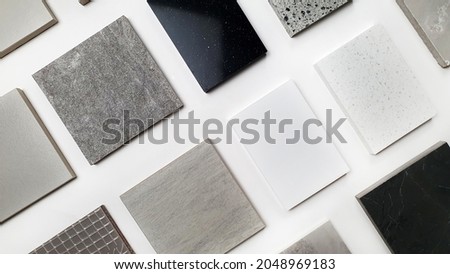 samples of interior stone material consists concrete tiles, quartz stones, artificial stones, graphic tile. top view of interior selected material for mood and tone board. interior materials palette. Royalty-Free Stock Photo #2048969183