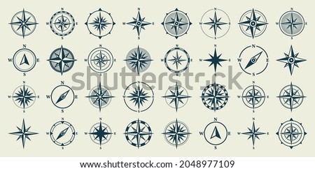 Vintage marine wind rose, nautical chart. Monochrome navigational compass with cardinal directions of North, East, South, West. Geographical position, cartography and navigation. Vector illustration. Royalty-Free Stock Photo #2048977109
