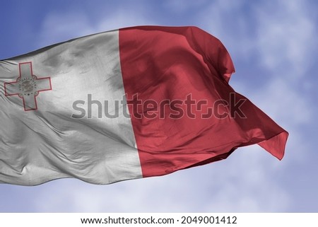 Malta flag isolated on the blue sky with clipping path. close up waving flag of Malta. flag symbols of Maltese. Royalty-Free Stock Photo #2049001412