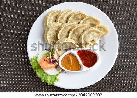 Nepalese traditional dumpling momo on the plate Royalty-Free Stock Photo #2049009302