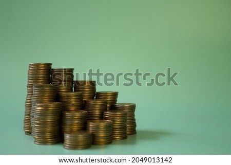 coins on a green background. personal finance