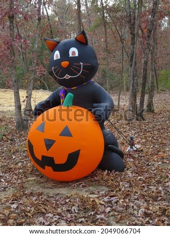 Inflatable Halloween decoration black cat with pumpkin and fallen leaves