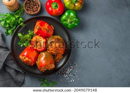 Homemade, stewed pepper stuffed with turkey, rice and vegetables. Healthy food. Top view, copy space. Royalty-Free Stock Photo #2049079148