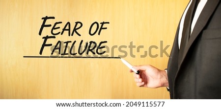 Hand writing inscription Fear of Failure, with marker,business concept