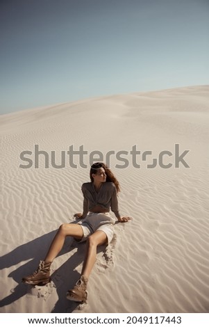 Safari Woman in Desert Outdoors, Dunes on the Background