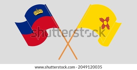 Crossed and waving flags of Liechtenstein and the State of New Mexico