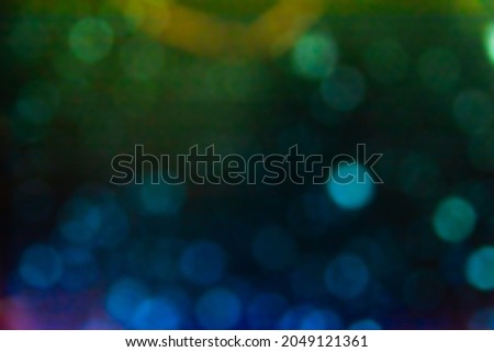 Multicolored bokeh with different shades on the background