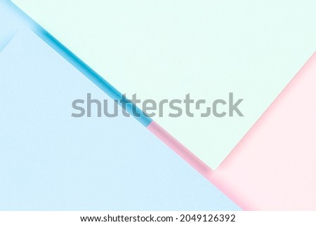 Pastel colored paper texture background. Minimal geometric shapes and lines in pink, light blue and green colors