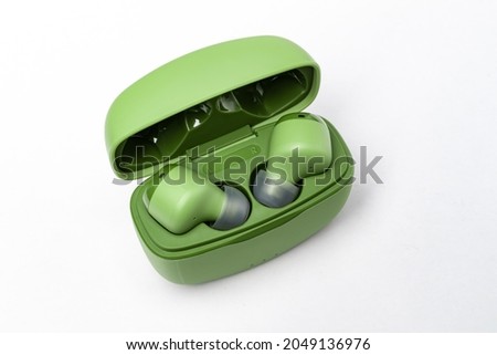 light green wireless headphones with box