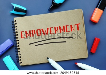  Financial concept about EMPOWERMENT with inscription on the piece of paper. 

