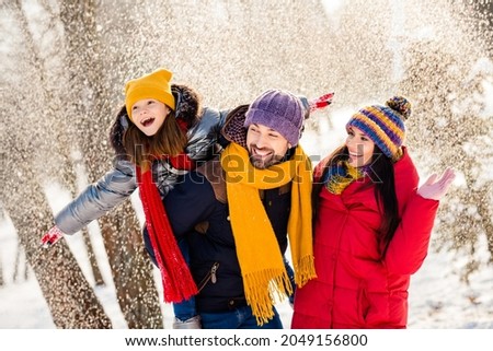 Photo of lovely family happy positive smile mommy daddy daughter piggyback hands wings fly snowy outdoors