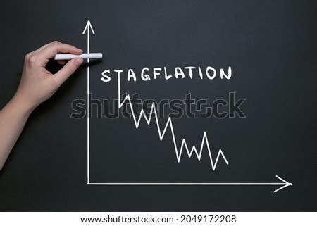 stagflation garfik, hand draws on the blackboard with chalk, the word stagflation, market fall and inflationary risks with the concept of a stifling economy Royalty-Free Stock Photo #2049172208