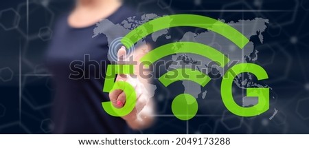 Woman touching a 5g concept on a touch screen with her finger