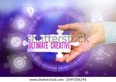 Text caption presenting Ultimate Creative. Concept meaning way of producing or using original and unusual ideas Hand Holding Jigsaw Puzzle Piece Unlocking New Futuristic Technologies.