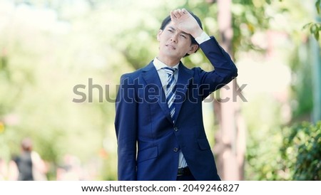 Standing figure of a hot businessman Royalty-Free Stock Photo #2049246827