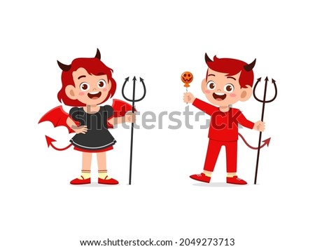 boy and girl celebrate halloween wear devil costume