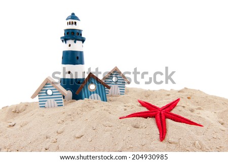 Blue beach houses and lighthouse isolated over white background
