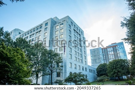 Tall vintage building with sun reflections and sunset