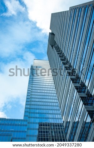 Street view of tall buildings with blue skies