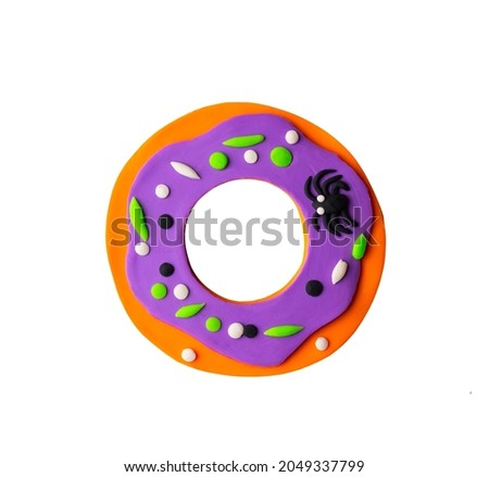 Cute halloween cream donut with spider, sprinkles. Spooky scary cartoon childish illustration with 3d effect in plasticine craft.
