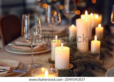 Beautiful table setting with Christmas decorations in living room, closeup
