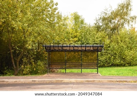 bus stop vertical billboard in front of blank street background Royalty-Free Stock Photo #2049347084
