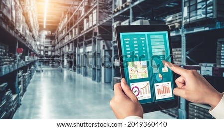 Warehouse management innovative software in computer for real time monitoring of goods package delivery . Computer screen showing smart inventory dashboard for storage and supply chain distribution . Royalty-Free Stock Photo #2049360440